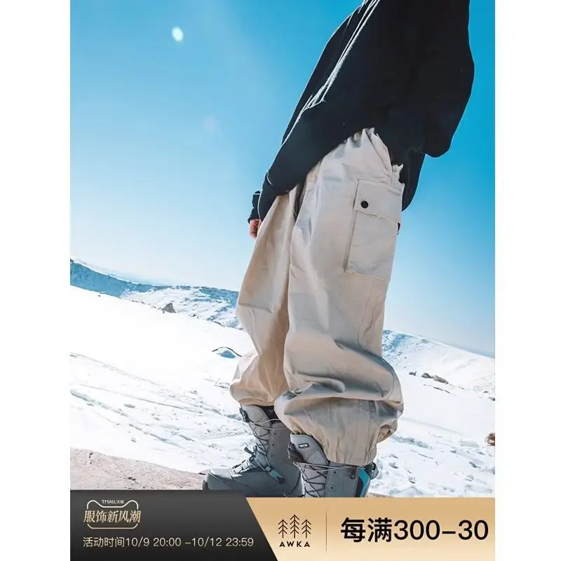 Man and Woman Skiing Baggy Pants